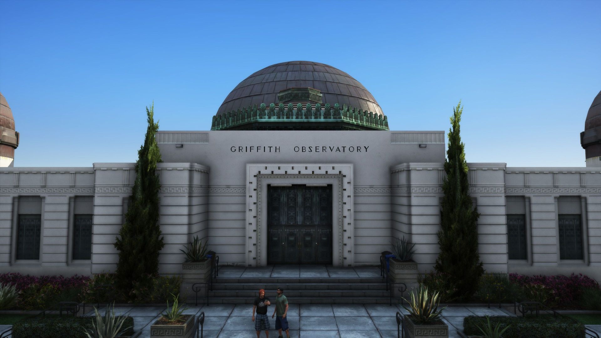 نمای ساختمان از جلو در کنار دو درخت